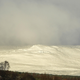CARRBRIDGE, SCOTLAND - NOVEMBER 27: Snow is seen covering hills on November 27, 2021 in Carrbidge, United Kingdom. The Met Office has issued the highest level of warning as wind speeds between 80 and 90mph hit north east Scotland and north east England bringing snow. Police have advised people not to travel as Storm Arwen poses a danger to life.